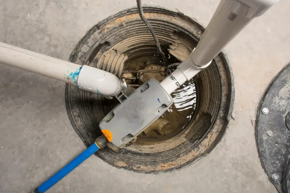 Sump basin with a pump and discharge piping
